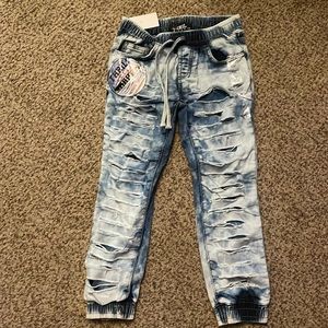 Kids ripped blue jeans